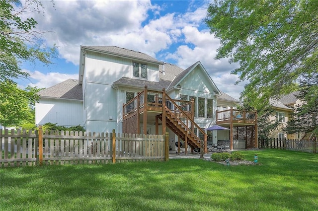 309 E 126th St, Kansas City, MO 64145 - rear view of house featuring stairs, a deck, a fenced backyard, roof with shingles, and a patio area