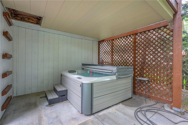 309 E 126th St, Kansas City, MO 64145 - view of patio / terrace with a hot tub