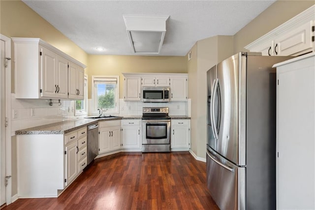 13701 W 149th St, Olathe, KS 66062 - kitchen featuring stainless steel appliances, dark wood-type flooring, and white cabinets