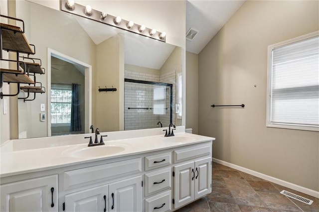 13701 W 149th St, Olathe, KS 66062 - full bath with double vanity, a shower stall, and vaulted ceiling