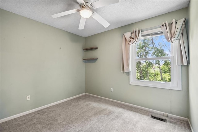 13701 W 149th St, Olathe, KS 66062 - carpeted spare room with a textured ceiling and ceiling fan