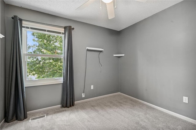 13701 W 149th St, Olathe, KS 66062 - carpeted spare room featuring plenty of natural light, ceiling fan, and a textured ceiling