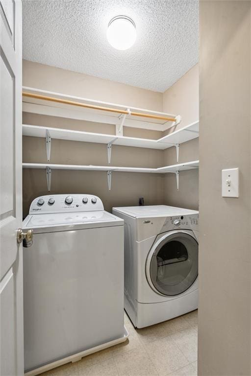 13701 W 149th St, Olathe, KS 66062 - washroom with independent washer and dryer, a textured ceiling, and light flooring