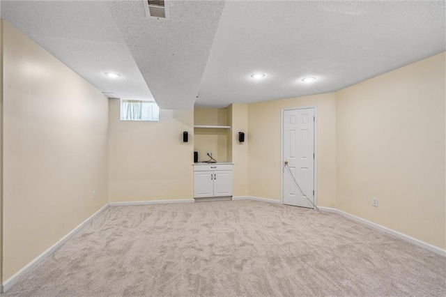 13701 W 149th St, Olathe, KS 66062 - basement with a textured ceiling, light colored carpet, and recessed lighting