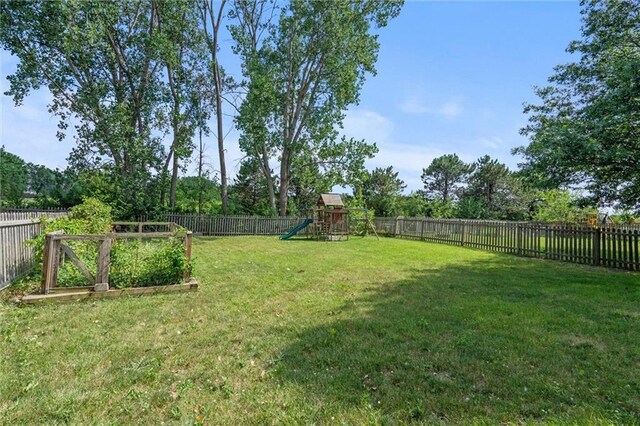 13701 W 149th St, Olathe, KS 66062 - fenced backyard with a playground