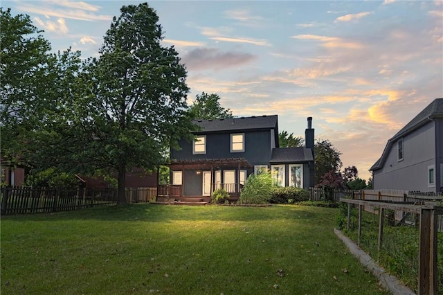 13701 W 149th St, Olathe, KS 66062 - rear view of house with a fenced backyard, a pergola, a wooden deck, and a chimney
