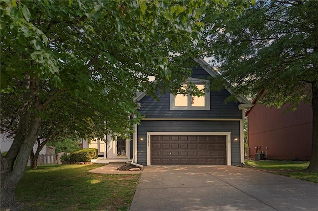 13701 W 149th St, Olathe, KS 66062 - view of front of property with a garage, concrete driveway, and a front lawn