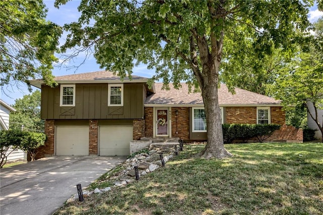 4430 E 107th Ter, Kansas City, MO 64137 - tri-level home with board and batten siding, driveway, a garage, a front lawn, and brick siding