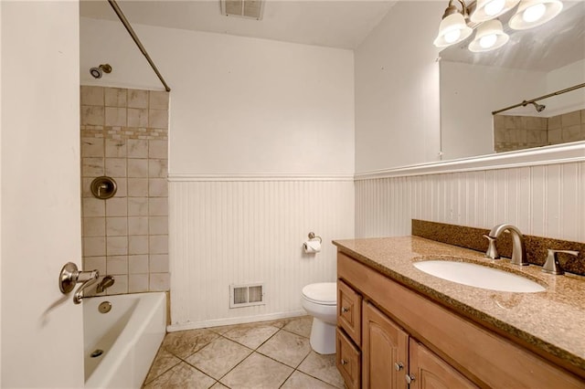 4430 E 107th Ter, Kansas City, MO 64137 - bathroom featuring vanity, tile patterned floors, shower / bath combination, a wainscoted wall, and a chandelier
