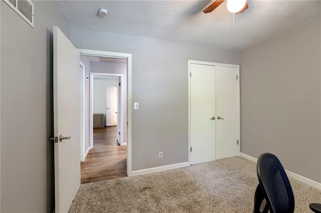 4430 E 107th Ter, Kansas City, MO 64137 - office area with a ceiling fan and carpet