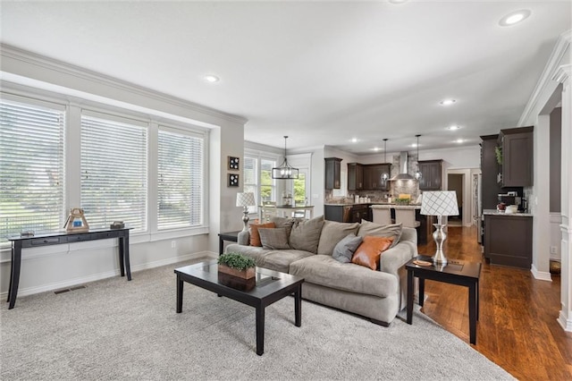 1220 Kingsland Cir, Raymore, MO 64083 - living room featuring ornamental molding, recessed lighting, and dark wood finished floors