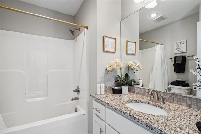 1220 Kingsland Cir, Raymore, MO 64083 - bathroom with vanity, shower / bath combo, and tasteful backsplash
