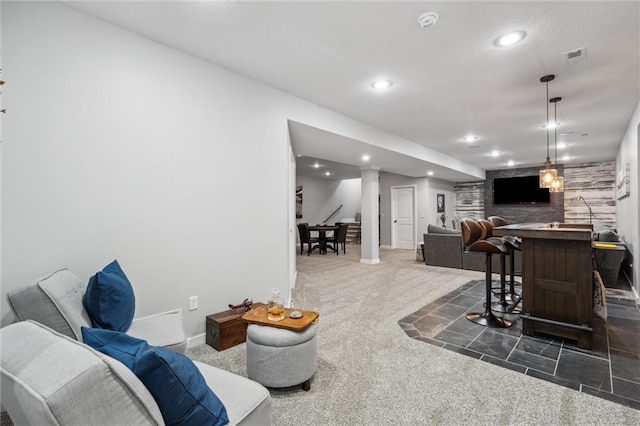 1220 Kingsland Cir, Raymore, MO 64083 - living room featuring dark carpet, bar area, and recessed lighting