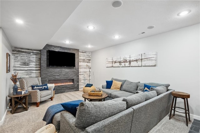 1220 Kingsland Cir, Raymore, MO 64083 - carpeted living area featuring a fireplace and recessed lighting