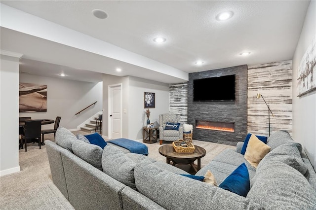 1220 Kingsland Cir, Raymore, MO 64083 - carpeted living area with a fireplace, recessed lighting, and stairway
