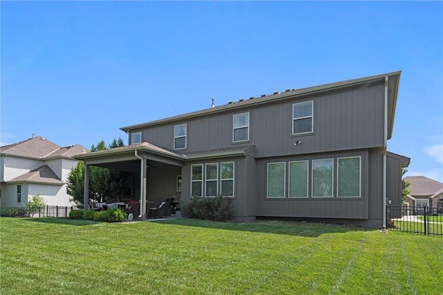 1220 Kingsland Cir, Raymore, MO 64083 - back of house featuring a ceiling fan