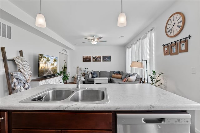 27104 E Cedar Grove Dr, Lees Summit, MO 64086 - kitchen featuring stainless steel dishwasher, a sink, open floor plan, ceiling fan, and decorative light fixtures