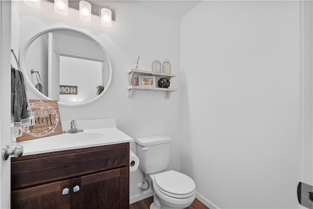 27104 E Cedar Grove Dr, Lees Summit, MO 64086 - bathroom featuring vanity, toilet, wood finished floors, and baseboards