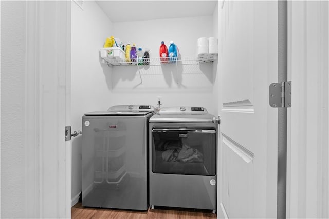 27104 E Cedar Grove Dr, Lees Summit, MO 64086 - laundry room featuring washer and dryer and wood finished floors