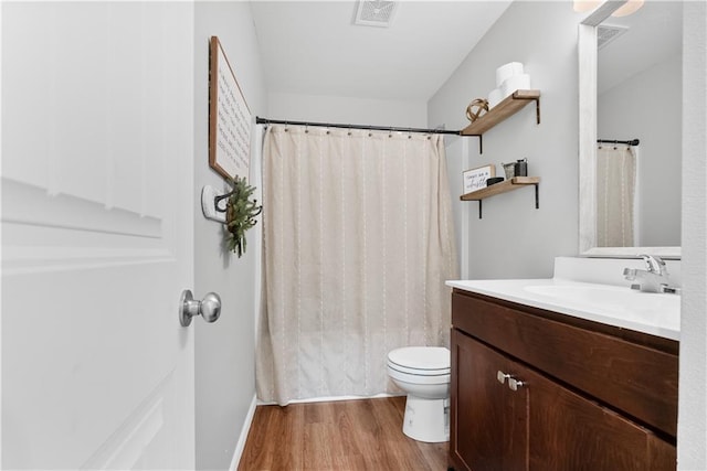 27104 E Cedar Grove Dr, Lees Summit, MO 64086 - full bathroom featuring wood finished floors, vanity, and toilet