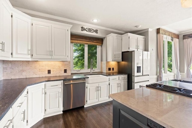 14605 Dearborn St, Overland Park, KS 66223 - kitchen with stainless steel appliances, ornamental molding, healthy amount of natural light, white cabinets, and recessed lighting