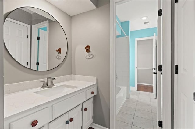 14605 Dearborn St, Overland Park, KS 66223 - full bathroom with vanity, tile patterned flooring, and washtub / shower combination