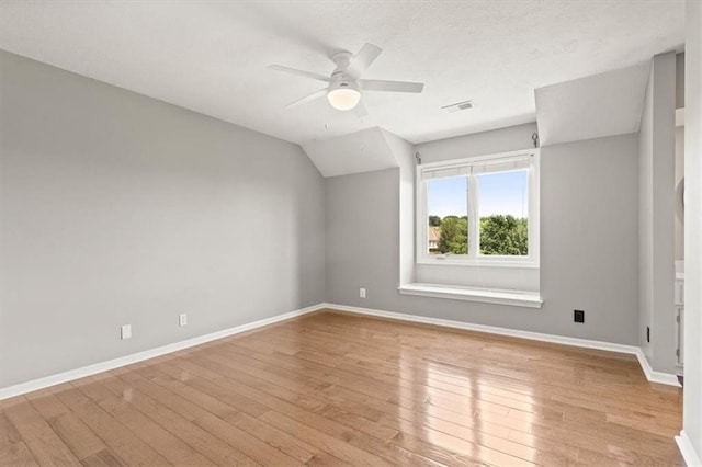 14605 Dearborn St, Overland Park, KS 66223 - unfurnished room with light wood-style floors, a ceiling fan, and vaulted ceiling