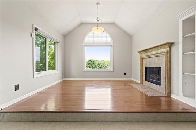 14605 Dearborn St, Overland Park, KS 66223 - unfurnished living room featuring hardwood / wood-style floors, a fireplace, lofted ceiling, and built in features