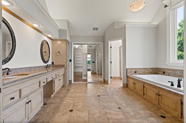 14605 Dearborn St, Overland Park, KS 66223 - bathroom with double vanity, a bath, and vaulted ceiling