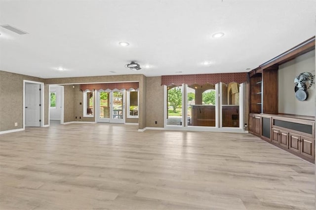 14605 Dearborn St, Overland Park, KS 66223 - unfurnished living room with light wood-style floors and recessed lighting