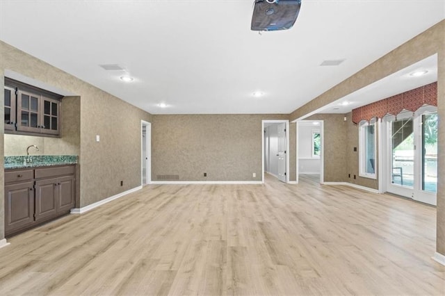 14605 Dearborn St, Overland Park, KS 66223 - unfurnished living room with light wood-style flooring and recessed lighting