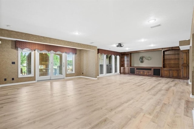 14605 Dearborn St, Overland Park, KS 66223 - unfurnished living room featuring light wood-style flooring, recessed lighting, and built in features