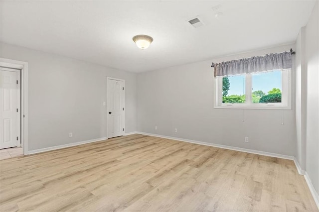 14605 Dearborn St, Overland Park, KS 66223 - unfurnished room with light wood finished floors and baseboards
