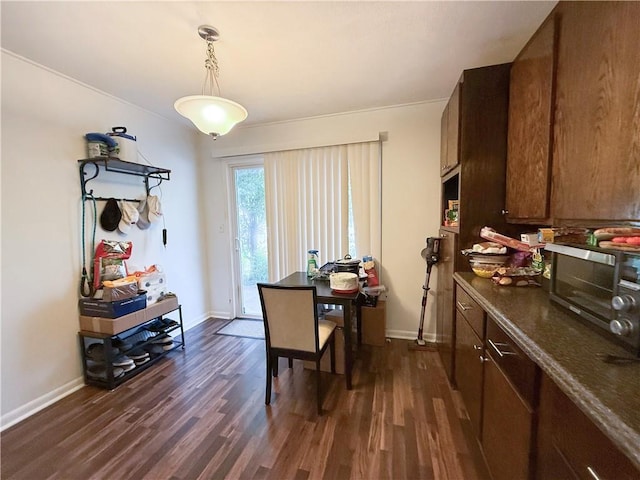 6521 W 49th St, Mission, KS 66202 - dining area featuring dark wood-style floors and baseboards