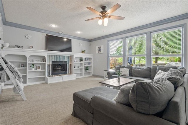 14105 W 115th St, Olathe, KS 66062 - living area featuring ornamental molding, a textured ceiling, ceiling fan, a fireplace, and carpet floors