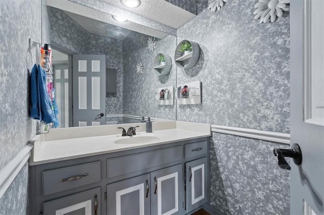 14105 W 115th St, Olathe, KS 66062 - bathroom with wallpapered walls and vanity