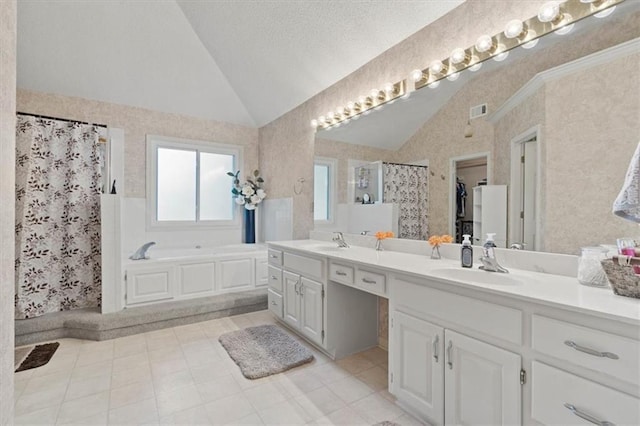 14105 W 115th St, Olathe, KS 66062 - full bathroom featuring vaulted ceiling, a shower stall, double vanity, a garden tub, and a walk in closet