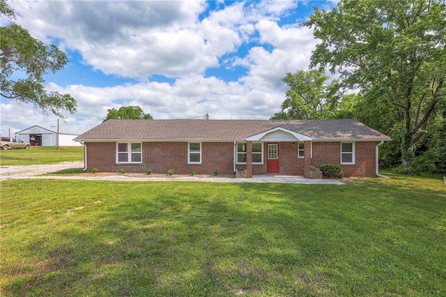1129 US Highway 50, Centerview, MO 64019 - single story home with a front lawn, brick siding, and a patio