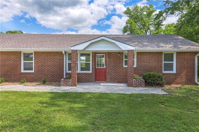 1129 US Highway 50, Centerview, MO 64019 - ranch-style home with brick siding, a front lawn, and a shingled roof