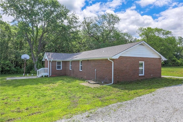1129 US Highway 50, Centerview, MO 64019 - view of property exterior with a yard and brick siding