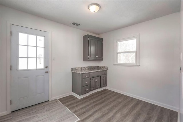 1129 US Highway 50, Centerview, MO 64019 - doorway with wood finished floors and baseboards