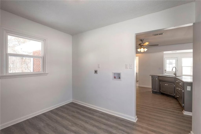 1129 US Highway 50, Centerview, MO 64019 - empty room featuring dark wood-style flooring and ceiling fan