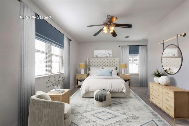 1129 US Highway 50, Centerview, MO 64019 - bedroom with wood finished floors and ceiling fan