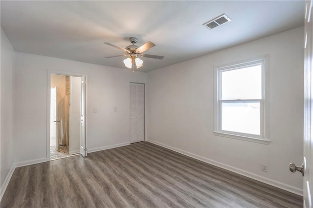 1129 US Highway 50, Centerview, MO 64019 - spare room featuring wood finished floors and a ceiling fan