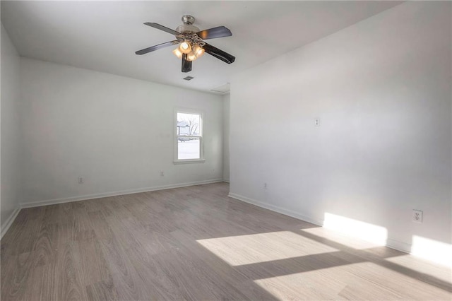 1129 US Highway 50, Centerview, MO 64019 - spare room with wood finished floors and a ceiling fan