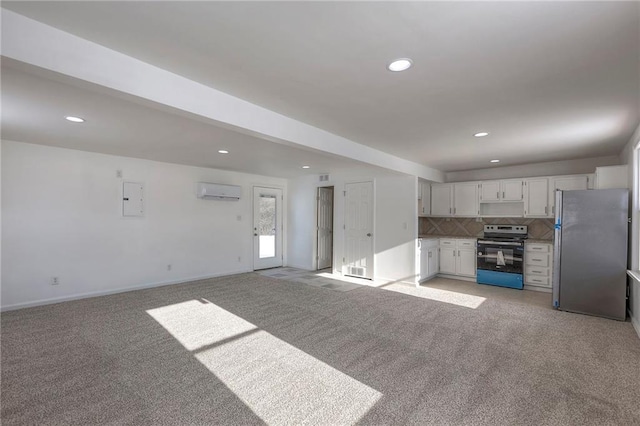 1129 US Highway 50, Centerview, MO 64019 - kitchen with stainless steel appliances, light colored carpet, recessed lighting, backsplash, and electric panel