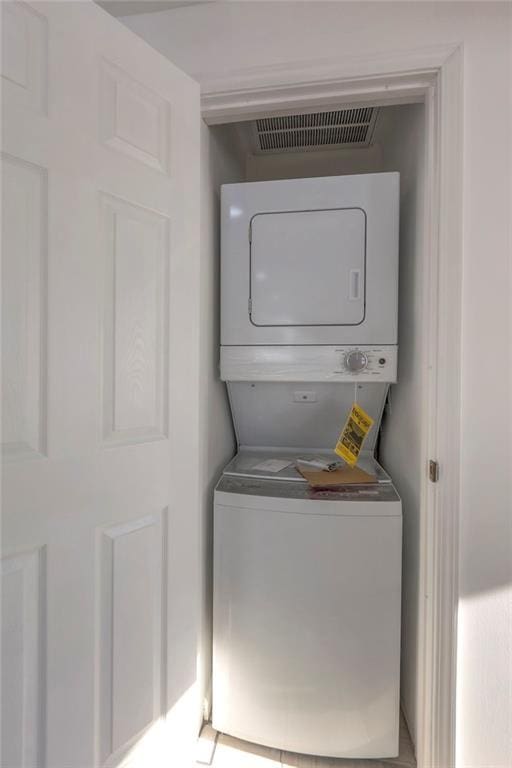 1129 US Highway 50, Centerview, MO 64019 - laundry area featuring estacked washer and dryer