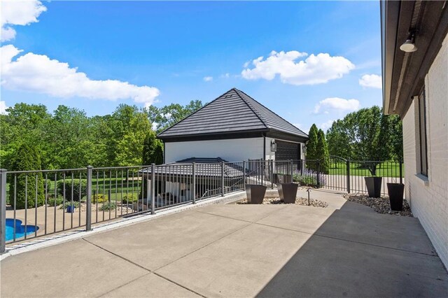 20711 Benson St, Bucyrus, KS 66013 - patio / terrace featuring a garage