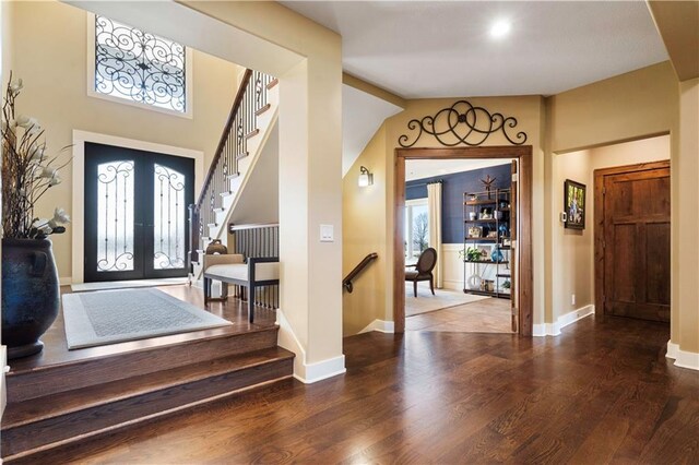 20711 Benson St, Bucyrus, KS 66013 - entryway featuring wood finished floors, stairway, and french doors