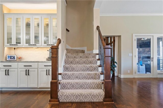 20711 Benson St, Bucyrus, KS 66013 - stairs featuring wood finished floors and ornamental molding